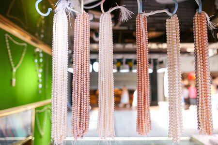 Pearl beads on a counter in a shopping center.の写真素材