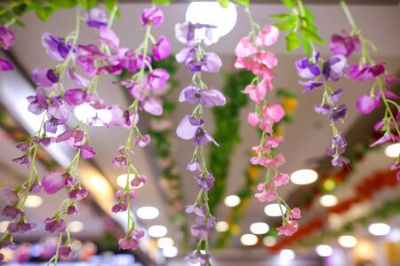 Artificial flowers as a decoration in a shopping center.の写真素材