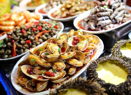 Seafood in a shop window in a cafe. A dish of Chinese cuisine.
