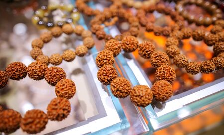 Walnut bracelets on a counter in a shopping center.の写真素材