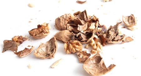 Walnuts isolated on a white background. Broken walnut, in pieces