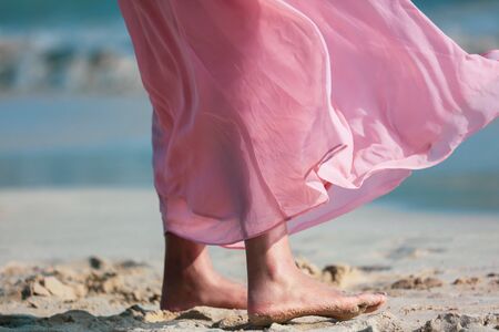 Pink fabric on a dress in the wind as a background.の写真素材