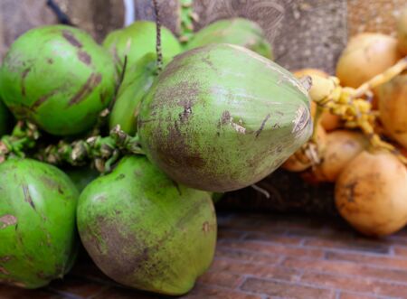 Fresh coconuts on the market. Exotic fruits.の写真素材