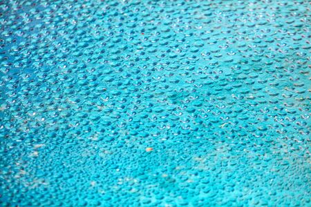 Drops of water on a blue background. Abstract texture.の写真素材