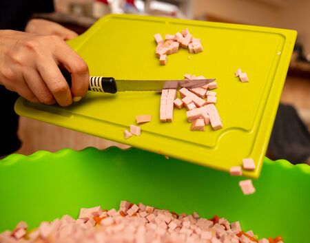 Sliced sausage on a plastic board. Cooking foodの写真素材
