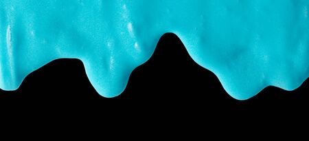 Blue slime isolated on black background. Jelly-like material for children to playの写真素材