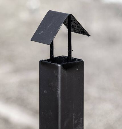 White smoke comes from a black metal pipe.の写真素材