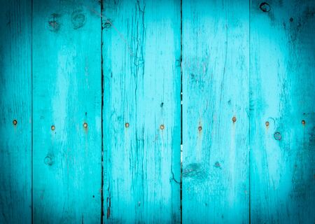 Wooden boards on an old blue fence as an abstract background. Texture.の写真素材