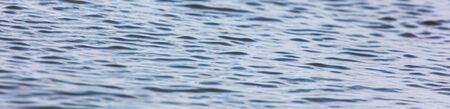 The surface of the water in the pond as an abstract background. Texture.の写真素材