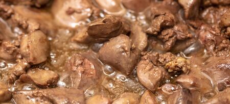 Chicken liver is fried in a pan. Macroの写真素材
