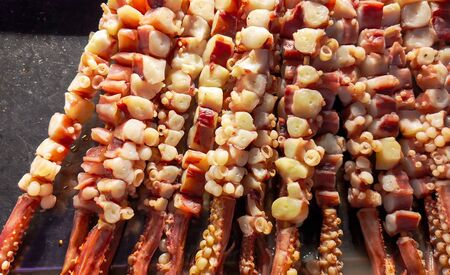 Octopus meat on skewers for frying on the grill. Exotic food