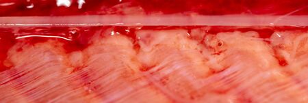 Red trout fish meat as abstract background. Macro