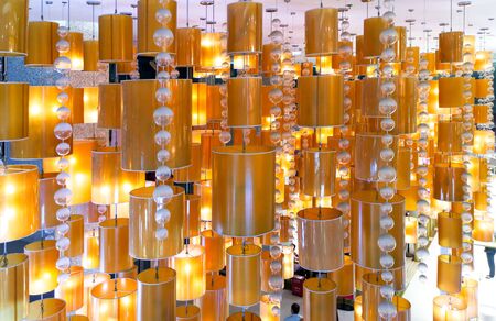 Golden lanterns on the ceiling as an abstract background.の写真素材