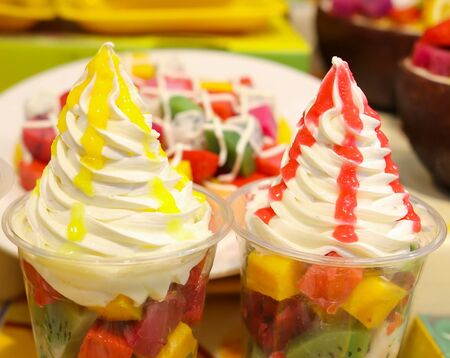 Ice cream with fruits and berries in a waffle glass. Sweet dessertの写真素材
