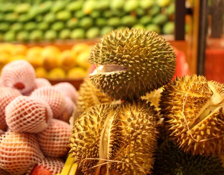 Durian on the counter in the market. Exotic fruit in the tropics.の写真素材