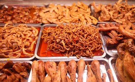 Roasted chicken waste in sauce. Exotic dish in China.の写真素材