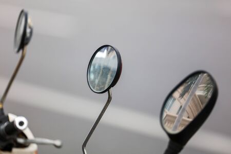 Mirror on the steering wheel of a bike. Transport
