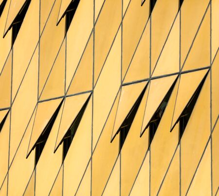 Wall decoration in the house with gold plastic as a background.