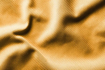 Golden fabric as an abstract background. Textureの写真素材