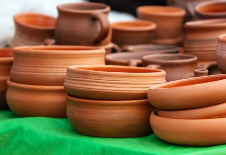 Clay dishes on a counter in the market.の写真素材