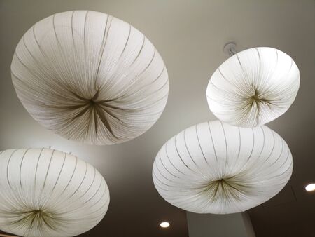 Large luminous white balls on the ceiling. Decoration