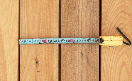 Meter on a wooden background. Tool at a home construction site.