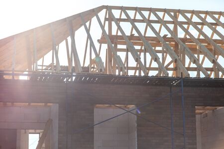 Wooden boards on the roof of the house against the sky. Home constructionの写真素材