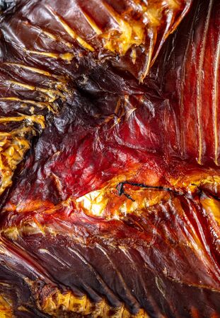 Smoked fish meat and ribs as a background. Macroの写真素材
