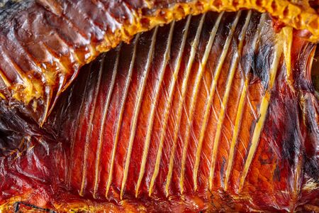 Smoked fish meat and ribs as a background. Macroの写真素材