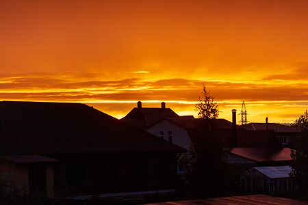 Colorful clouds at sunset in the village as a background.の写真素材