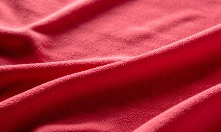 Red factory fabric as an abstract background. Texture
