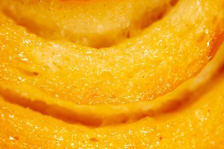 Close-up of a golden crust bun as a background. Macroの写真素材