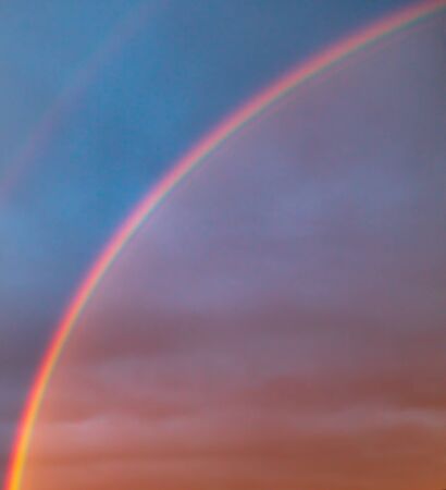 Rainbow in the sky as a background. The spectrum of the rays of sunlight in the atmosphere.の写真素材
