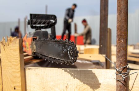 Chainsaw at a construction site at home. Work toolの写真素材