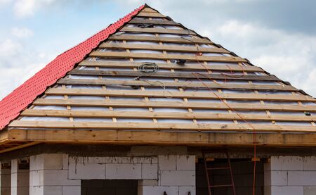Wooden boards on the roof. Home constructionの写真素材