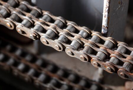 A metal chain on a motor as a backdrop. Technologyの写真素材