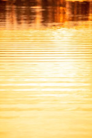 The expanse of water at sunset in summer. Abstract backgroundの写真素材