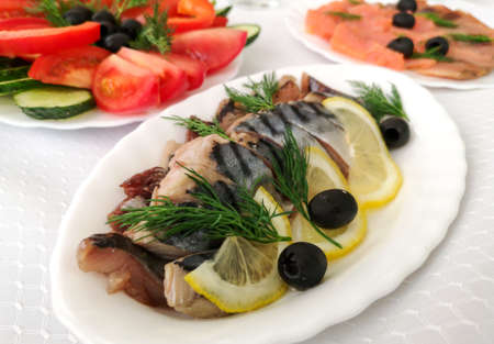 Dishes and fish salads on the festive table.の写真素材