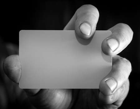 Close-up of a plastic card in a man's hand.の写真素材