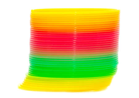 Multi-colored rainbow spring on a white background. Children toyのeditorial素材