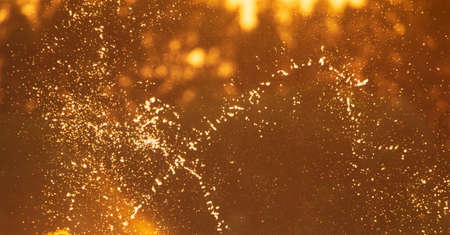 Water spray at sunset in summer. Abstract backgroundの写真素材