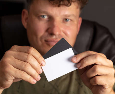 Closeup plastic card in man's hand.
