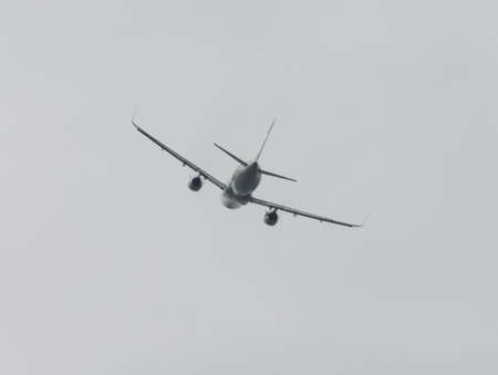 Silhouette of an airplane at sunset. Air Transportの写真素材