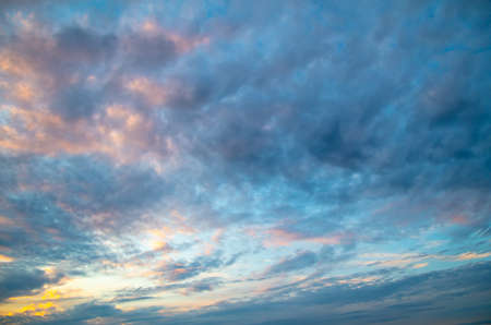 Clouds after rain on the sky at sunset. Background