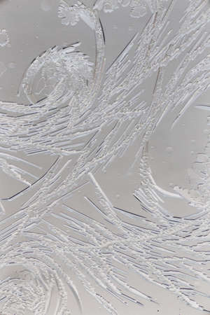 Snow patterns on glass as an abstract background.