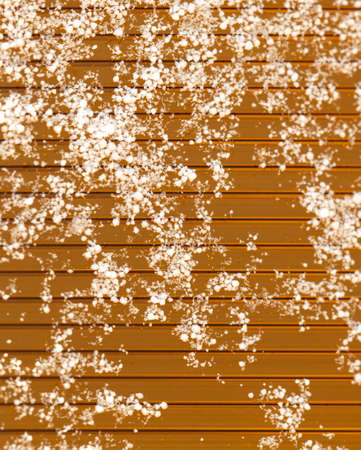Snowflakes on an orange background. Abstraction texture.の写真素材