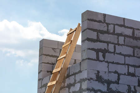 Construction of the walls of the house from foam concrete bricks. Technologyの写真素材