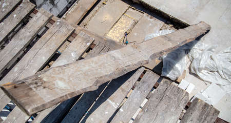 Wooden boards at a house construction site. Material