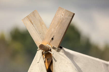 Wooden boards on the roof of the tent.