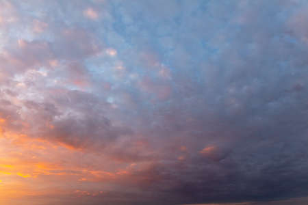 Clouds in the sky at sunset as background.